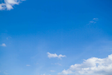 Naklejka na ściany i meble Cumulus clouds. White clouds on a blue background.