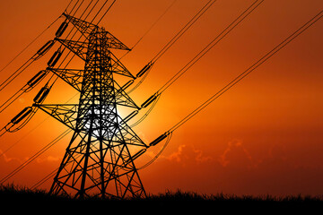 silhouette of the structure of high voltage transmission towers rural electric power distribution...