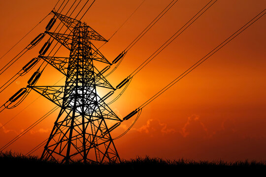 silhouette of the structure of high voltage transmission towers rural electric power distribution concept
