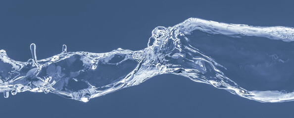Fototapeta na wymiar Water splash on a blue background. Reflection on the surface of the water.