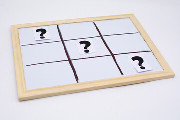 question mark on the tic-tac-toe field. FAQ frequency asked questions, Answer and Brainstorming Concepts