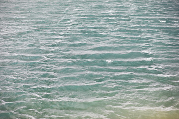 Water surface. The texture of the water. Waves on the lake in windy weather.