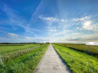 Straight walking path to Ummanz island during summer