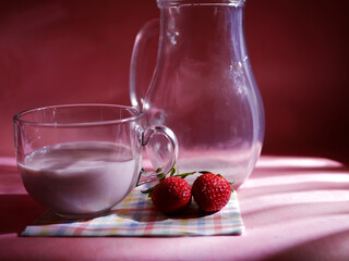 Strawberry milkshake on pink background medium shot 