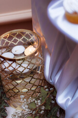 Preparation for the wedding ceremony. Flowers and podiums to decorate the location. Candlesticks...