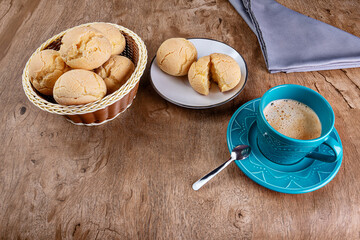 Typical Brazilian cheese bread in a basket with coffee