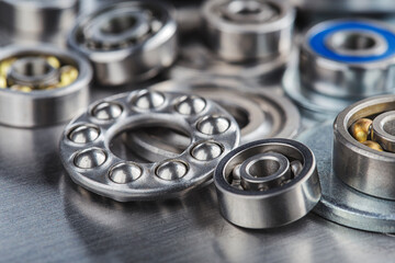 different bearings on a metal background. Part of mechanism.