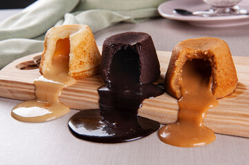 Three types of petit gateau, chocolate, dulce de leche and white chocolate. - obrazy, fototapety, plakaty