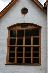 Obraz premium facade of an old brick building with a large window