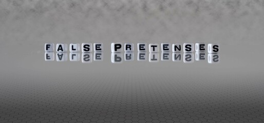 false pretenses word or concept represented by black and white letter cubes on a grey horizon...