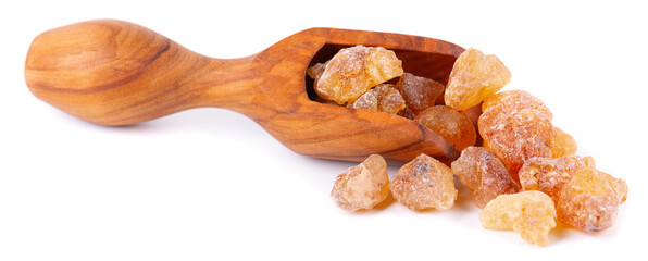 Frankincense resin in olive scoop, isolated on white background. Pile of natural frankincense Olibanum. Incense.