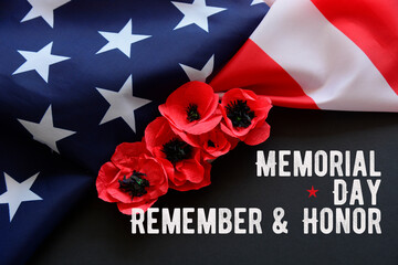 Text Memorial Day on American flag And a poppy flower background	
