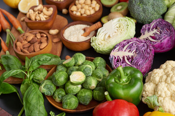 Different vegetables, seeds and fruits on table. Healthy diet..vegetarian, vegan food cooking ingredients. Flat-lay of vegetables, fruit, beans, cereals, kitchen utencil, dried flowers, top view.