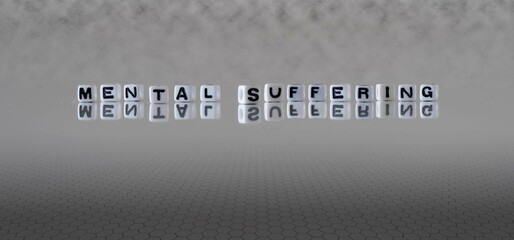 mental suffering word or concept represented by black and white letter cubes on a grey horizon background stretching to infinity