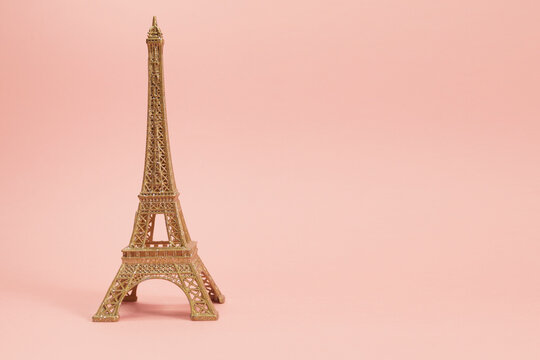 golden effiel tower souvenir with pink background