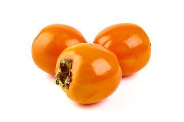 Fresh Ripe Rersimmons with juicy half, close-up, isolated on white background.