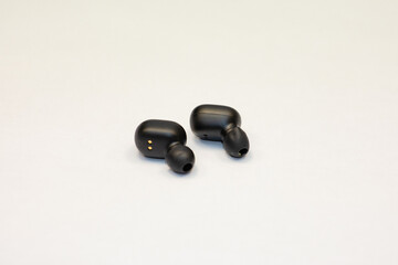 Wireless phone headphones. Hands free. Cellular communication.