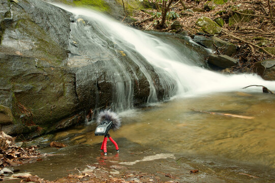 A Zoom H6 Field Recorder Microphone In the Wild. Perched below a small Waterfall while Collecting Sounds.