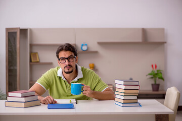 Young male student studying at home