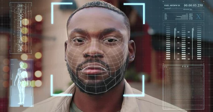 Portrait of africa american man standing on city street and looking at camera with running holograms of his private information. Facial recognition system of people outdoors.
