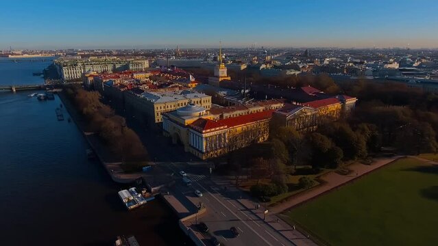 Aerial footage of St. Isaac Cathedral in the morning, the crowns of the trees of the Alexander Park and the monument to Peter the Great, rooftops of houses near attractions