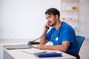 Young male doctor working in the clinic