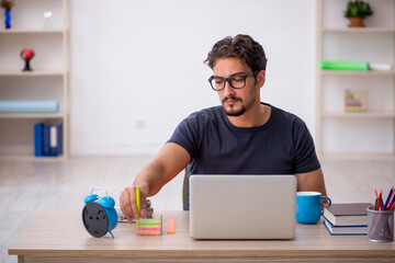 Young male designer working in the office