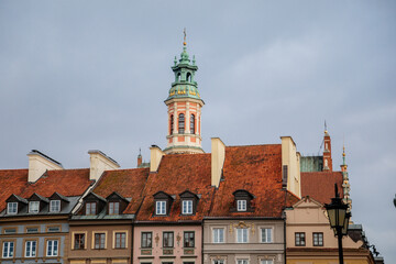 Warsaw, Poland, 13 October 2021: Main market square with fountain in old town, medieval colorful historic renaissance baroque buildings at sunny day, UNESCO World Heritage Site, ancient architecture