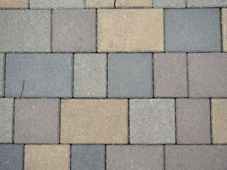Multi-colored pavement. Stones on the pavement. Pavement tiles background