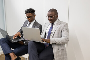 working african business people in office with laptop	