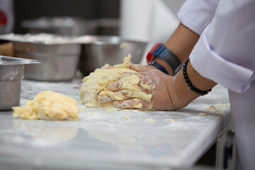 A gastronomy student making dough for Apple Pie