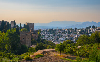 Obraz premium Aerial view of the city with historic center of Granada with some part of Alcazaba castle and Sierra Nevada on background