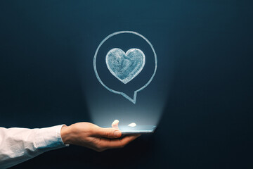 Like icon in a bubble under smartphone. Cellphone with screen notification symbol. Social media feedback message