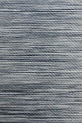 Gray fabric background from textile dense material with wicker pattern, close up. Fabric structure. Fabric background