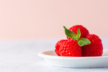 ripe raspberry macro on a colored background
