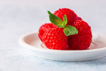 ripe raspberry macro on a colored background