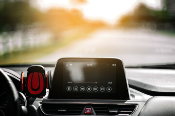 Driving a car on an empty road. Car inside view. Turn on the radio and listen to music in the car.