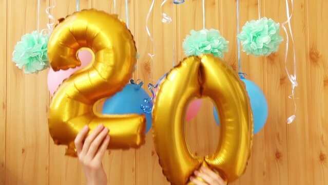 Golden numbers twenty 20 - air balloons and colorful decorations