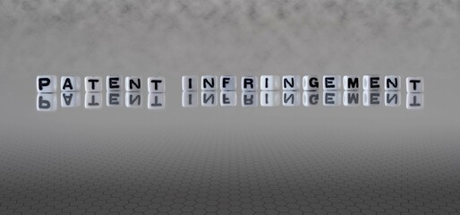 patent infringement word or concept represented by black and white letter cubes on a grey horizon background stretching to infinity - obrazy, fototapety, plakaty