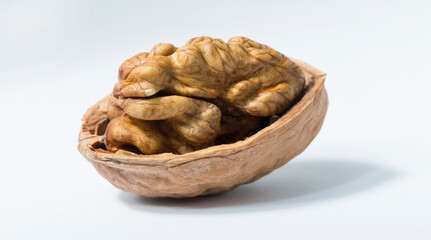 Walnuts are rounded, single-seeded stone fruits of the walnut tree. Cracking a nut.