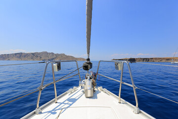 Fototapeta na wymiar Bow of sailing yacht, view from a sailboat
