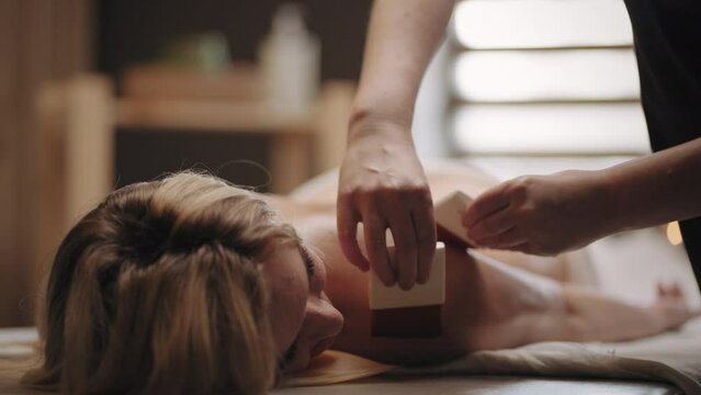 relax and rest in massage parlor in spa-salon, traditional egyptian oil brush massage, enjoy and pleasure