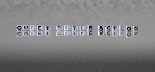 quiet title action word or concept represented by black and white letter cubes on a grey horizon background stretching to infinity - obrazy, fototapety, plakaty