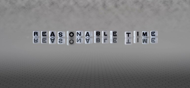 reasonable time word or concept represented by black and white letter cubes on a grey horizon background stretching to infinity