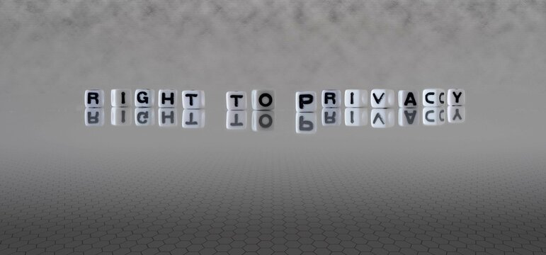 right to privacy word or concept represented by black and white letter cubes on a grey horizon background stretching to infinity