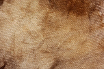 Old fabric with brown stains full frame for background, murder case idea, old blood stains on fabric.