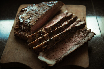 juicy roast beef on wood base