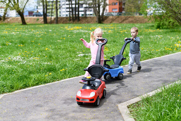 Little Kids Teaching to Drive A Toy Car