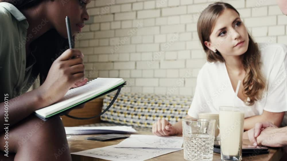Aufkleber group of businesspeople talking about paperwork during meeting at a cafe. group of architects talkin