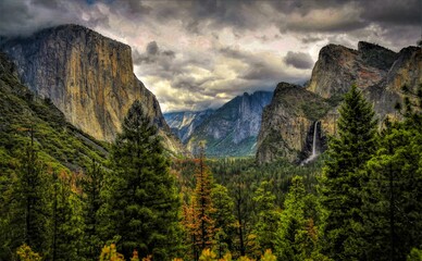 Yosemite Valley with water falls and rain clouds
